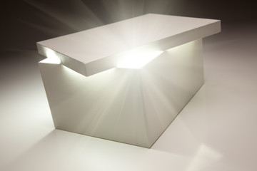 White Box with Lid Revealing Something Very Bright