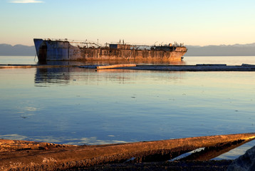 Old Freighter Moored as  a Breakwater - 24404291
