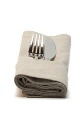 knife and fork in textile napkin