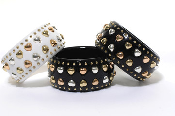 Stack of bracelets on white