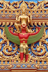 Fototapeta na wymiar art on gable - Narai Song Suban, Wat Kwan Muang, Borabue