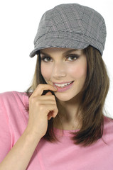Portrait of young woman in gray hat
