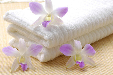 Fototapeta na wymiar Spa towels with orchid