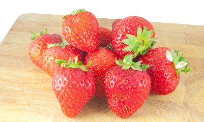 strawberies on chopping board isolated on white