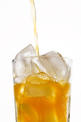 glass of orange juice with ice