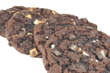 four large chocolate cookies isolated on white background
