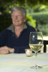 Senior women with glas of wine