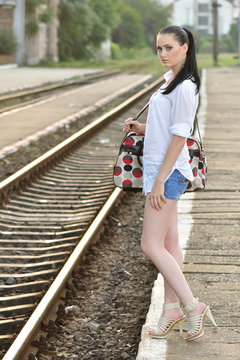 Beautiful young girl being ready to travel with train