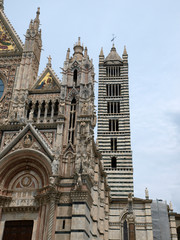 Fototapeta na wymiar Duomo and Campanile facades in Siena, Tuscany