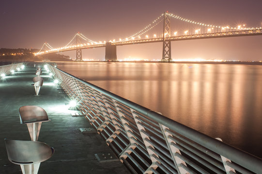 Bay Bridge at Night from pier in San Francisco