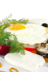 egg on white plate with vegetables