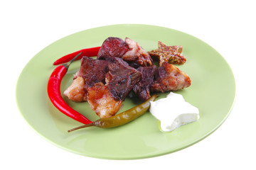 roast meat chunks on green plate