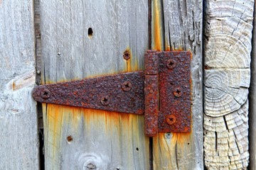 rusty aged iron hinge weathered gray wood door