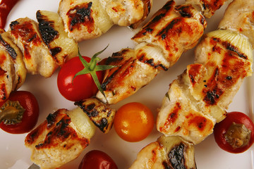 roast chicken shish kebab on white
