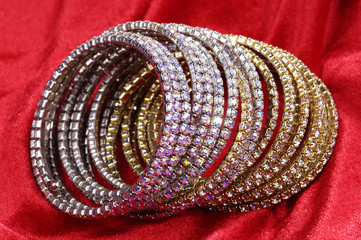 Fashion bracelets on red background