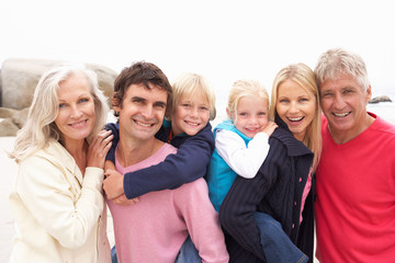 Obraz premium Close Up Of Three Generation Family On Winter Beach