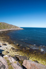 Fototapeta na wymiar Sea cliff in blue lagoon