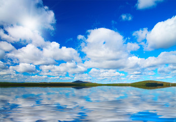Distant coast of blue lake