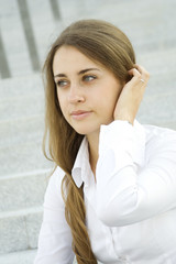 Fototapeta premium Young businesswoman wondering