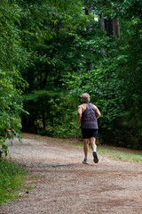 Jogger on Woodland Path