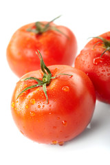 fresh tomatoes on the white background