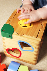 child playing with shape sorter