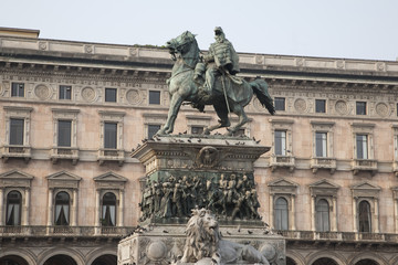 Fototapeta na wymiar Vittorio Emanuele Statue in Duomo Square in Milan, Italy