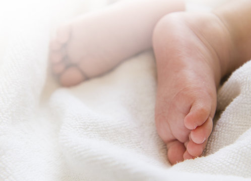 Closeup view of newborn baby feet