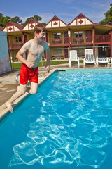 Naklejka premium boy is jumping into the pool