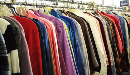Row of different clothes on a rack