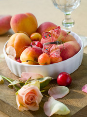 Fresh fruits in bowl with butterfly