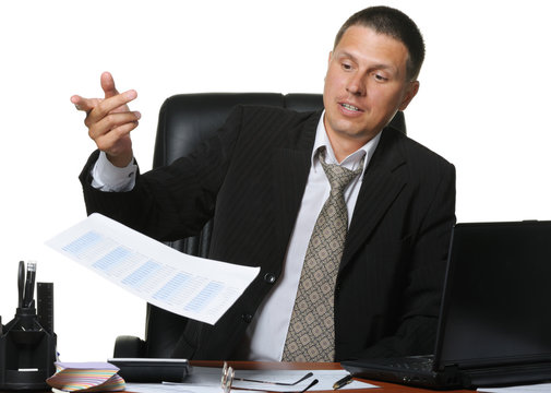 The businessman discontentedly throws the financial report