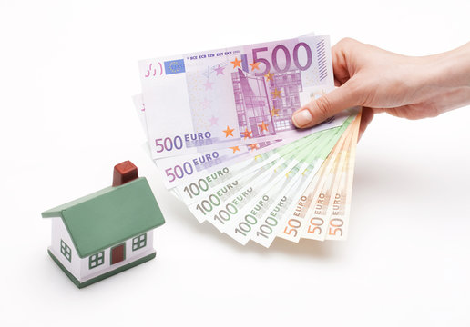 hand holding Euros; real estate loan concept