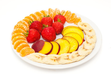 fresh slices of fruit on a plate isolated