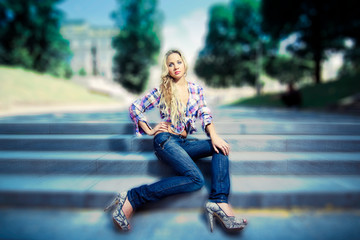 Young woman sitting on the stairs