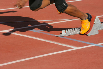 athlete in start blocks