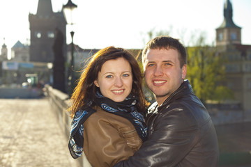 young couple on the Charles Bridge on the skyline