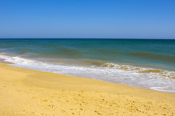 Fototapeta na wymiar Beautiful desert beach in Algarve, south of Portugal