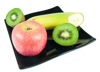 fruit on black plate isolated on white background