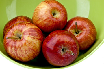 apples in a green bowl