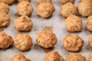Roast meatballs on baking sheet. Shallow DOF