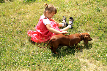 four-year-old girl and a dog