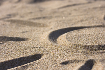Fototapeta na wymiar Sonne - Symbol im Sand