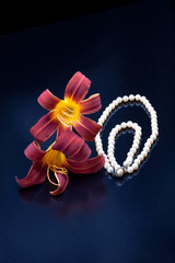 Pearl necklace by lilies.