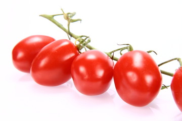 Bunch of tomatoes on white background