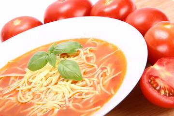Tomato soup with macaroni and basil with fresh tomatoes