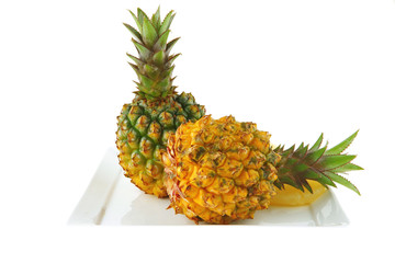 fresh ripe pineapples on plate