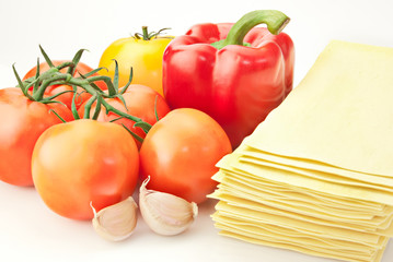 Lasagna ingredients.Tomato, pepper, garlic and lasagna sheets