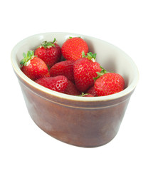 strawberries in ceramic bowl isolated on white