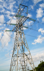 Wonderful blue sky and electrical pylon.